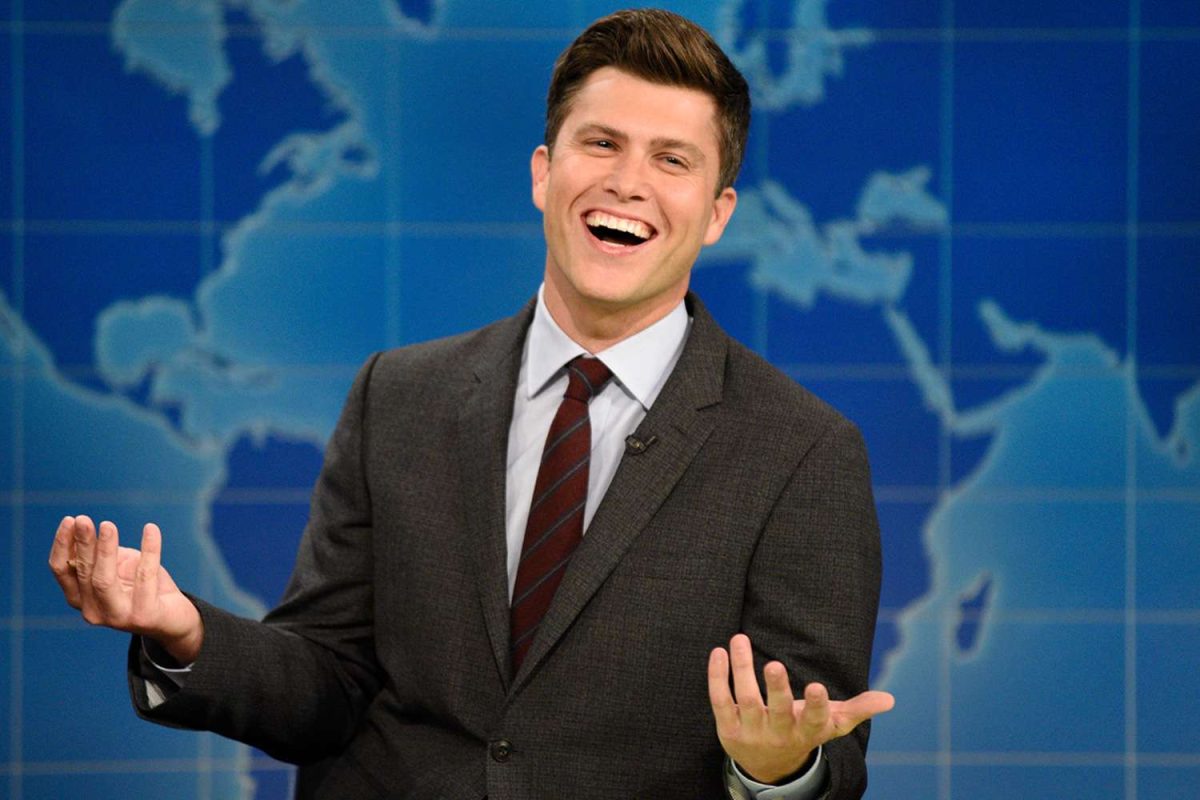 Colin Jost on the set of Weekend Update (via Us Weekly)